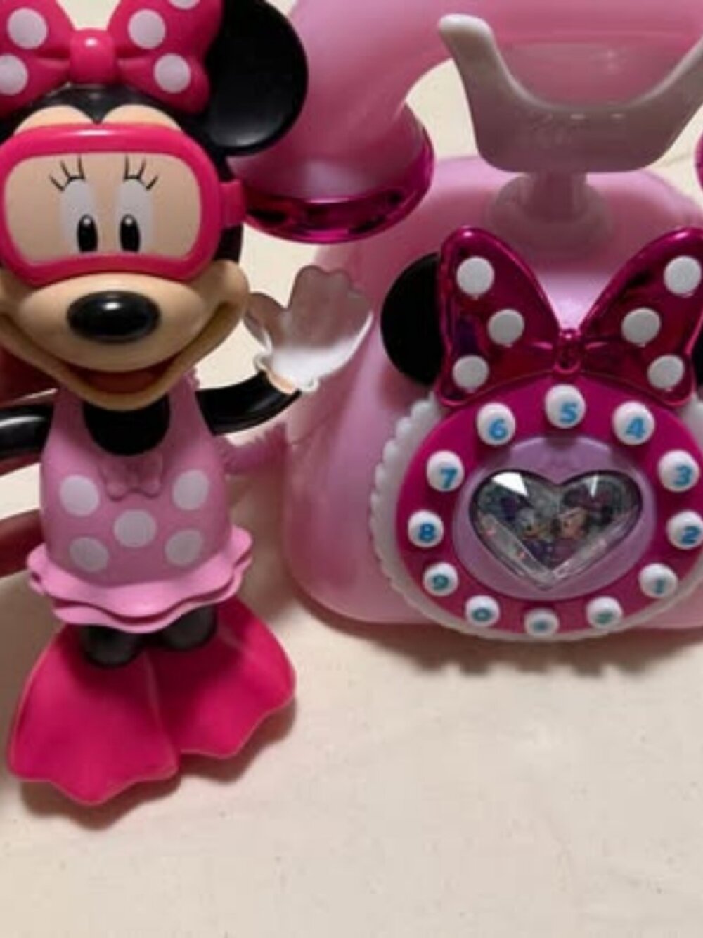 Minnie Mouse bath toy and rotary phone toy